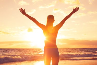 Happy Free Woman at Sunset on the Beach clipart