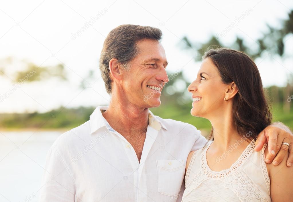 Mature Couple Enjoying Walk on the Beach