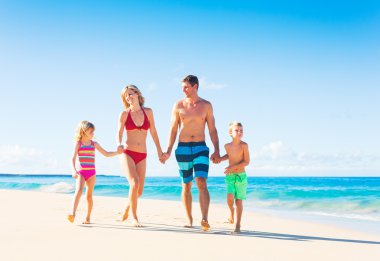 Happy Family at the Beach clipart