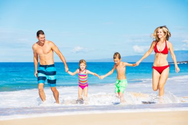 Happy Family at the Beach clipart
