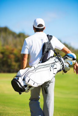 Golfer Walking with Bag clipart