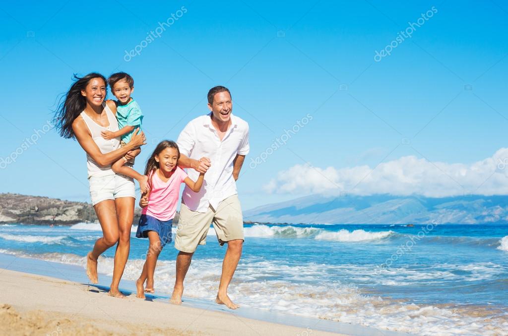 Happy Family on the Beach Stock Photo by ©EpicStockMedia 54335783
