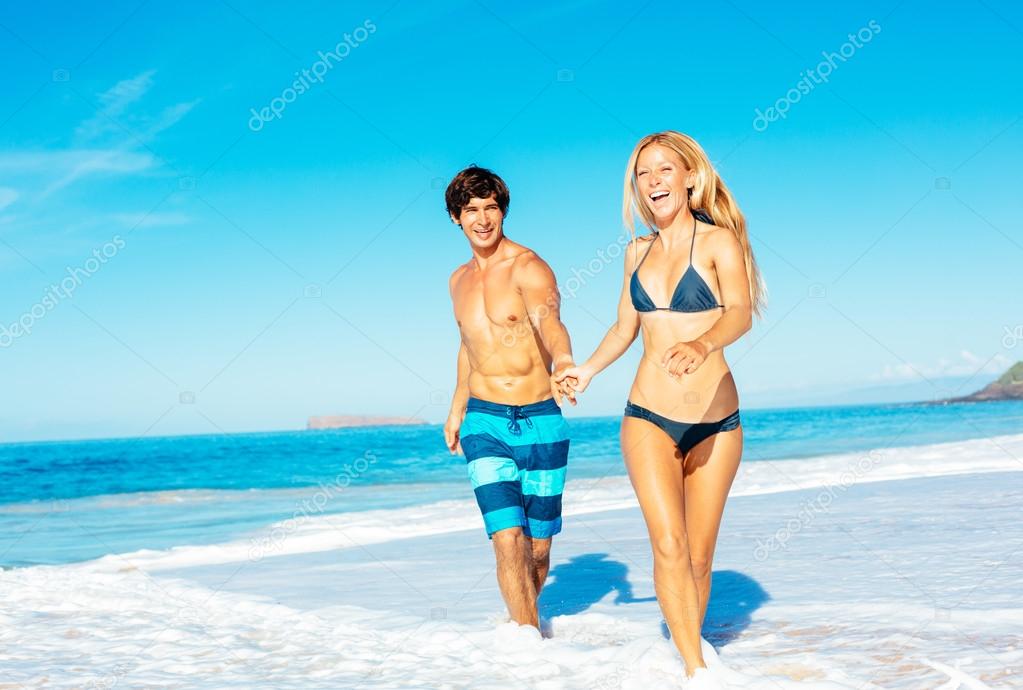 Atractive Couple Having Fun on the Beach