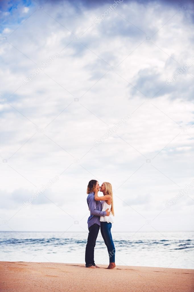 Young Couple Kissing on the Sea Shore