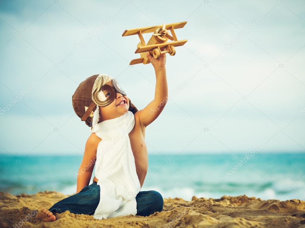 Small Boy and toy airplane