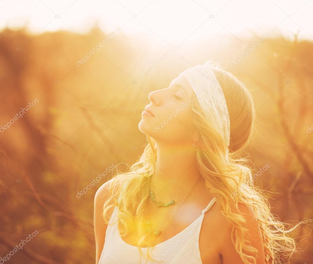 Happy Young Woman Outdoors at Sunset.