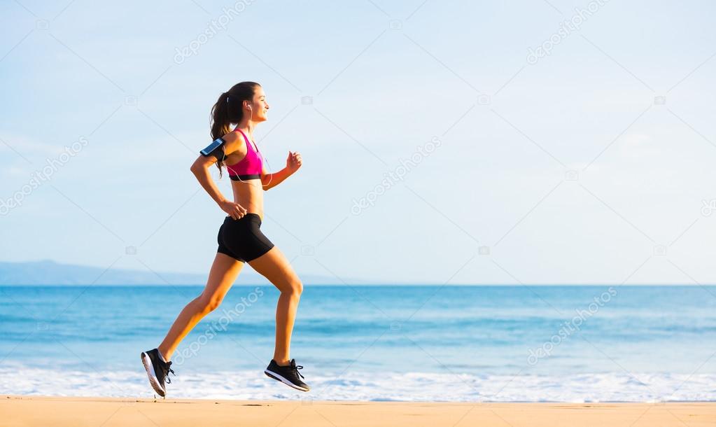 Sports Fitness Woman Running on the Beach