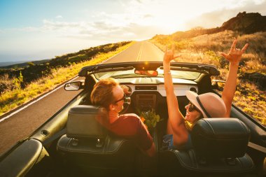 Happy Couple Driving in Convertible clipart