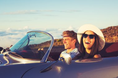 Young Couple in Classic Vintage Sports Car clipart