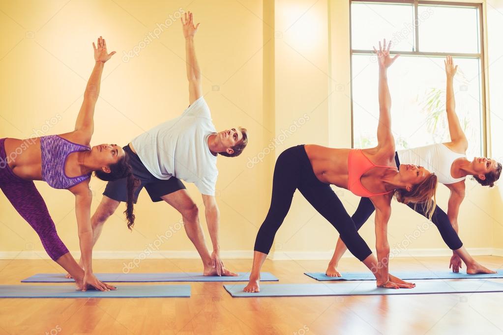 People Relaxing and Doing Yoga