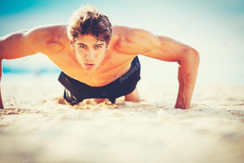 Male Athlete Exercising Doing Push-Ups
