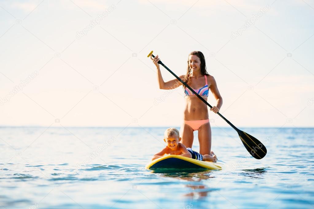 Mother and Son Stand Up Paddling Together