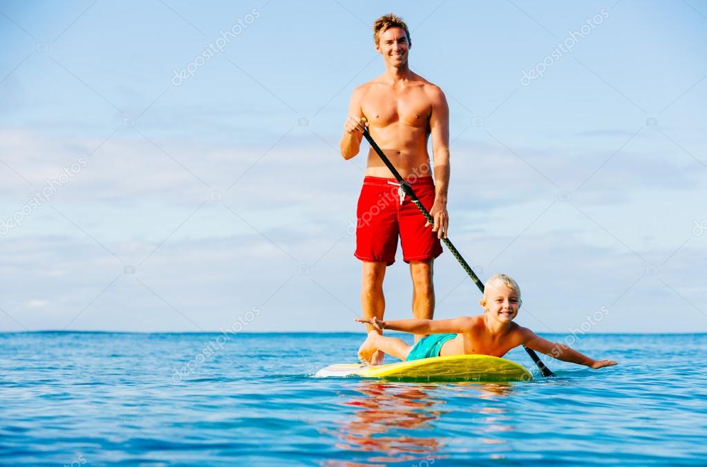 Father and Son Stand Up Paddling — Stock Photo © EpicStockMedia 83541962