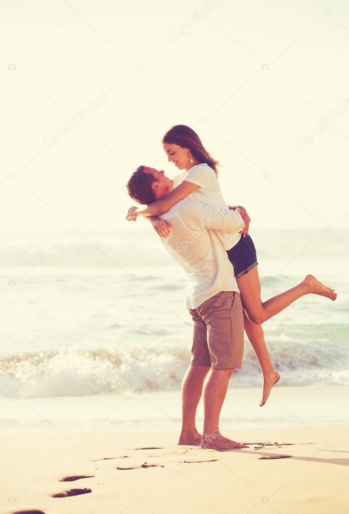 Young Romantic Couple Playing on the Beach
