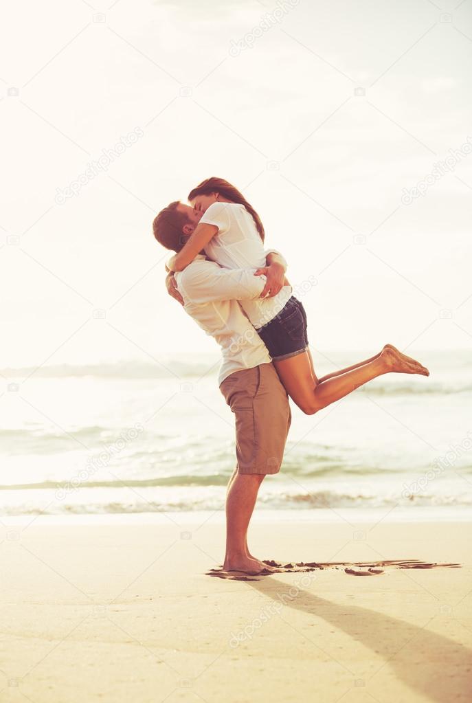 Young Romantic Couple Playing on the Beach