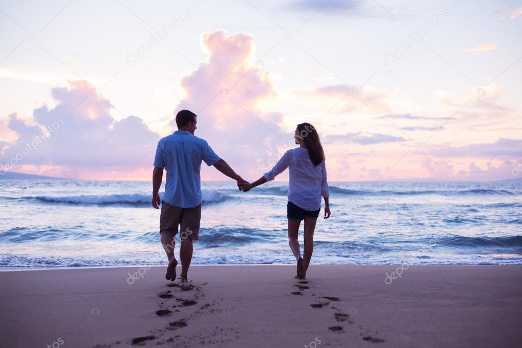 Lovers Walking on the Beach at Sunset — Stock Photo © EpicStockMedia