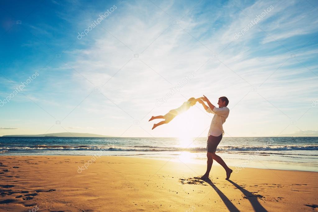 Father and Son Playing on the Beach