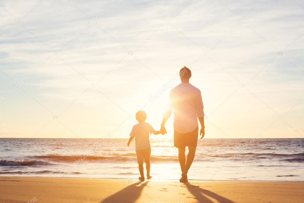 Father and Son Walking Together on the Beach