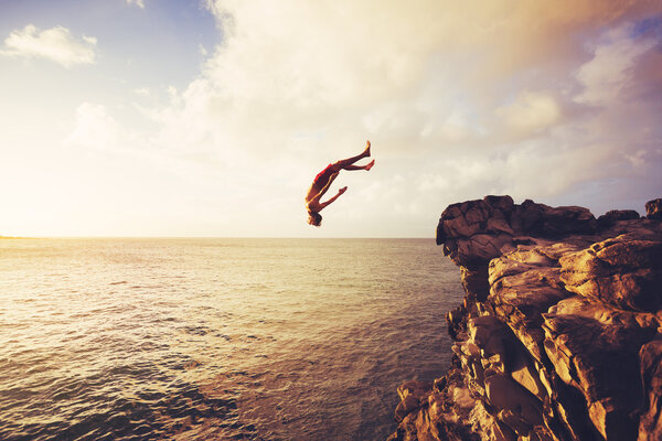 Cliff Jumping extreme at sunset