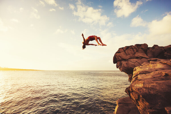Cliff Jumping extreme at sunset