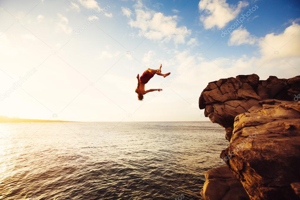 Cliff Jumping extreme at sunset