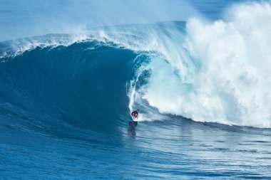 Surfer Rides GIant Wave at Jaws clipart