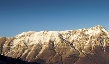 Apennines mountain range near Assergi in Italy. evening view of beautiful peak. Gran Sasso natural reserve landscape