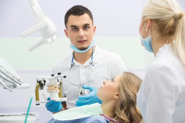 Modern dental clinic, young dentist working Stock Image