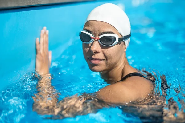 Sportive girl in the swim pool