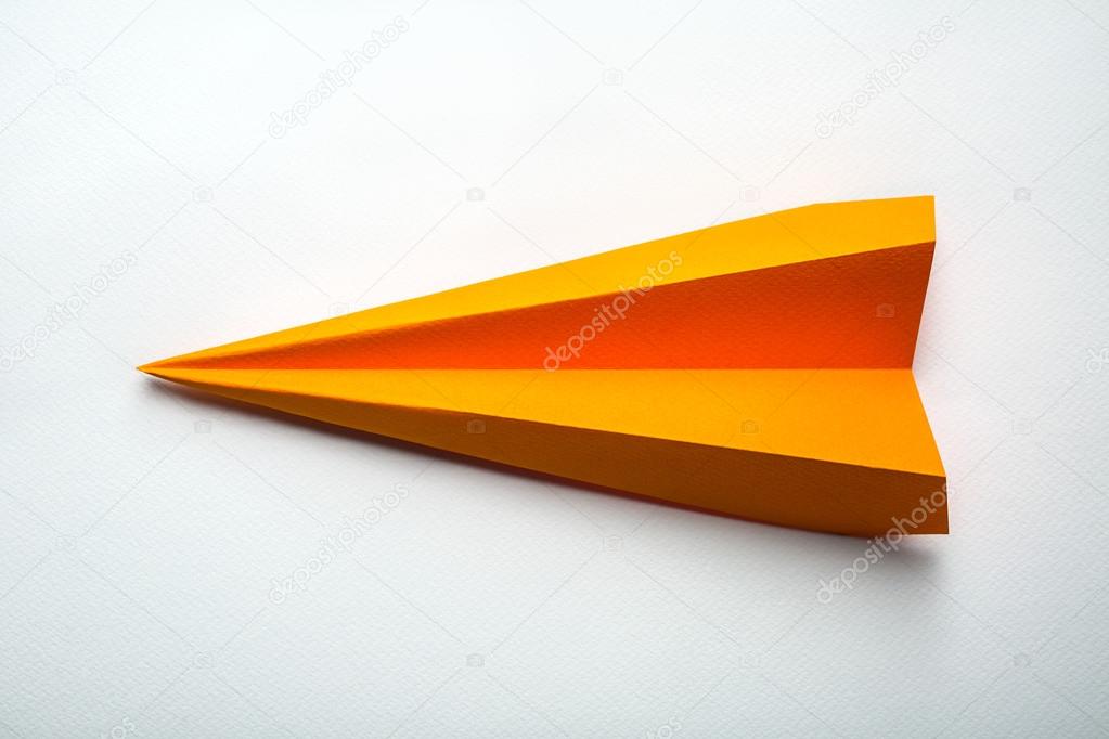 Orange origami paper airplane