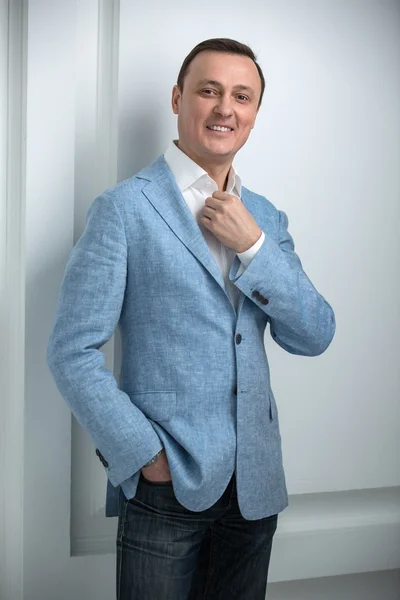 Handsome man in a blue jacket — Stock Photo, Image