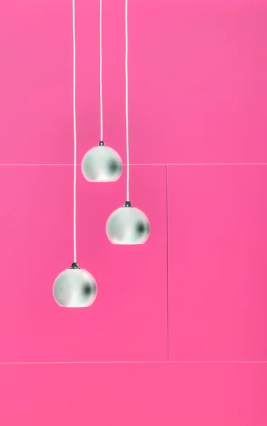 Pimk negative collage of three ceiling lights — Stock Photo, Image