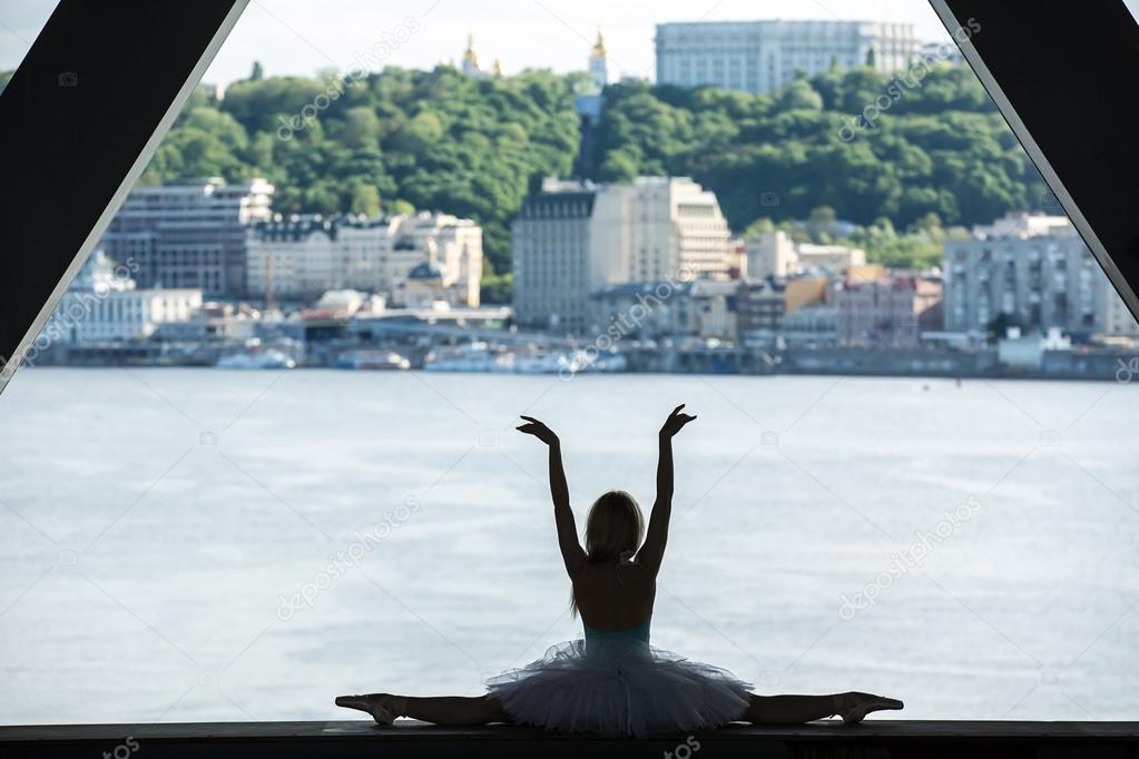 Silhouette of graceful ballerina in white tutu