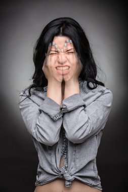 Multi exposure portrait of emotional brunette.