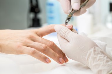 Manicure process in a beauty salon clipart