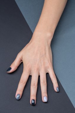 Female hand with a stylish neutral manicure