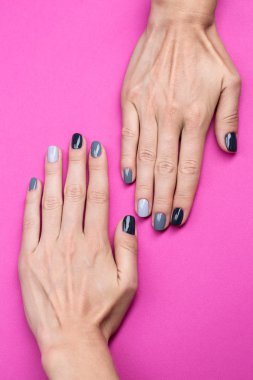 Delicate female hands with a stylish neutral manicure