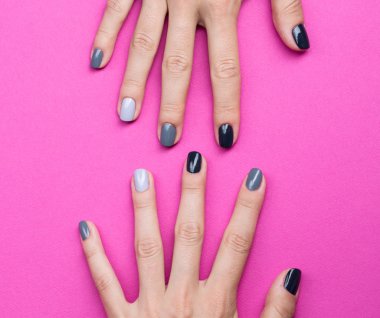 Delicate female hands with a stylish neutral manicure