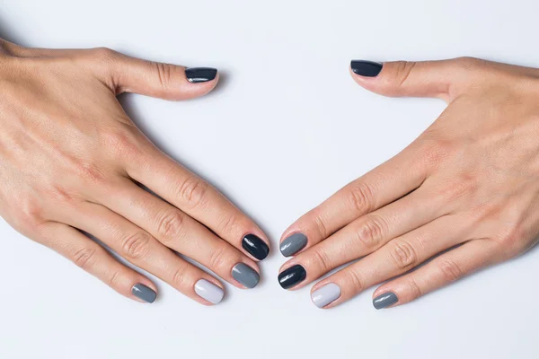 Hand with a stylish gray manicure isolated on white background — 스톡 사진