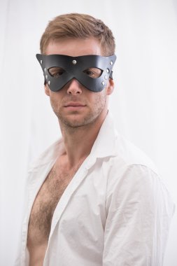 Handsome guy in the BDSM leather mask 