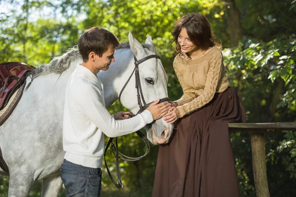 Young couple riding — Stockfoto