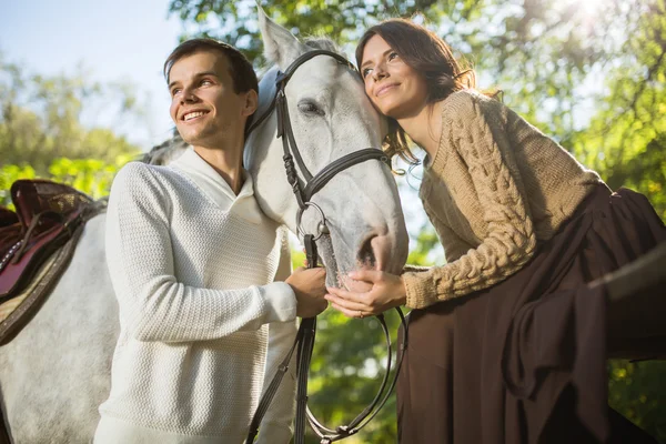 Young couple riding — Φωτογραφία Αρχείου