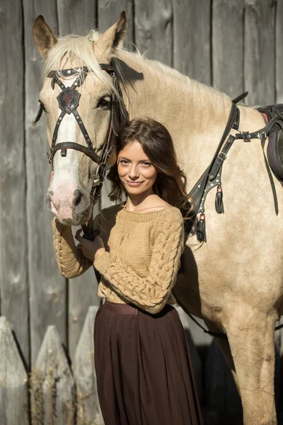 Young attractive girl is walking with his horse — Stock Photo, Image