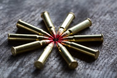 Macro shot of small-caliber tracer rounds with a red tip