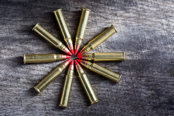 Macro shot of small-caliber tracer rounds with a red tip — 스톡 사진