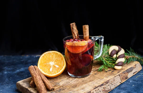 Hot Mulled Wine for winter and Christmas on wooden table with copy space. Red Hot wine. New years concept