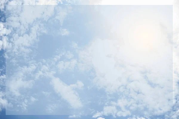 Beautiful summer sky with clouds and rays of sun. A natural background from the sky. Nature, a place for text White fluffy clouds in the blue sky.