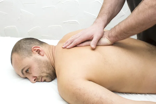 Man doing sports massage — Stock Photo, Image