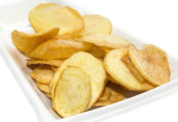 Patatas fritas en un plato blanco — Foto de Stock