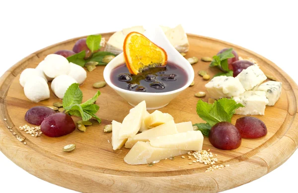 Cheese plate with a large decorated — Stock Photo, Image